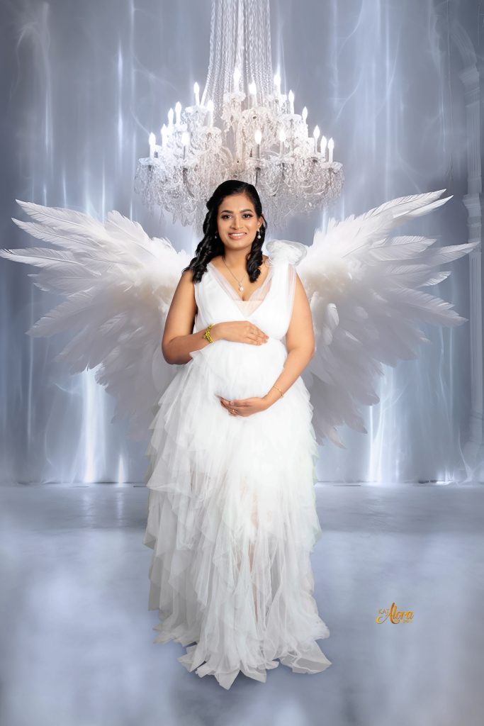 Pregnant mother wearing an elegant maternity gown during a luxury maternity photoshoot at Kat Alora Photography studio in Cranbourne North near Cranbourne East Melbourne.