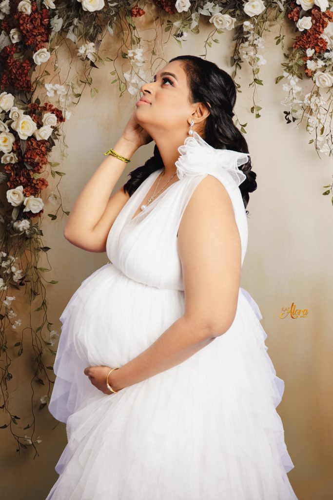 Pregnant mother posing during luxury maternity photography session in Cranbourne North Melbourne studio by Kat Alora Photography