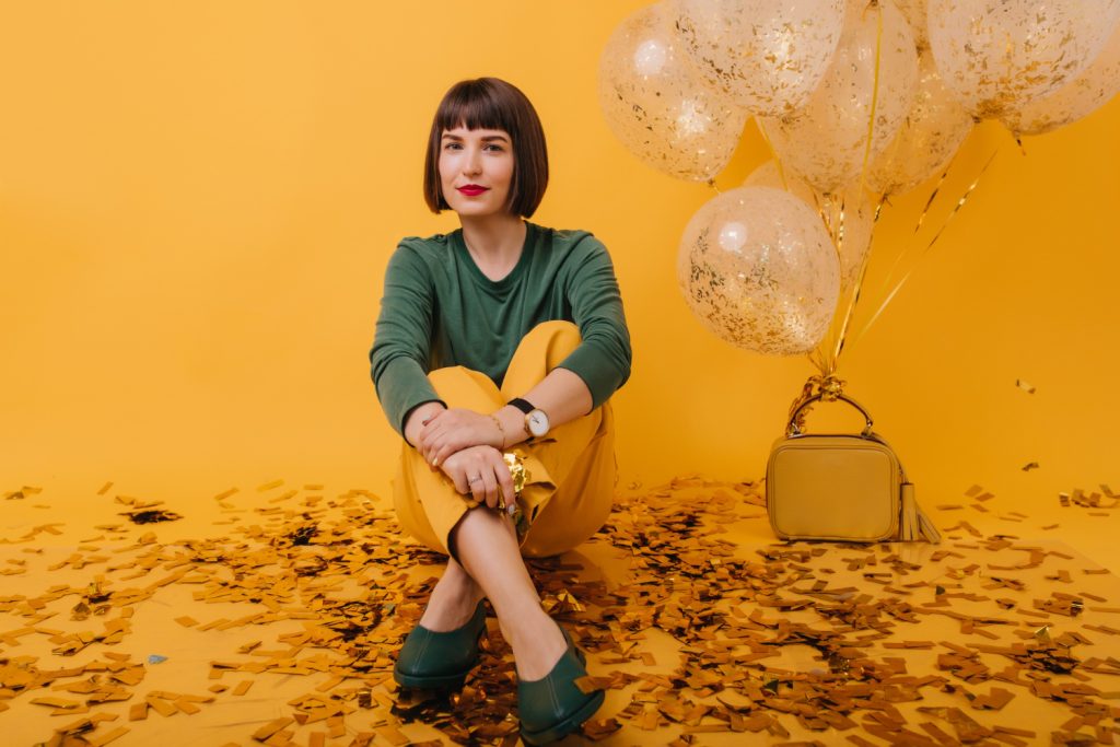 Woman celebrating milestone birthday during luxury birthday photoshoot in Melbourne studio by Kat Alora Photography