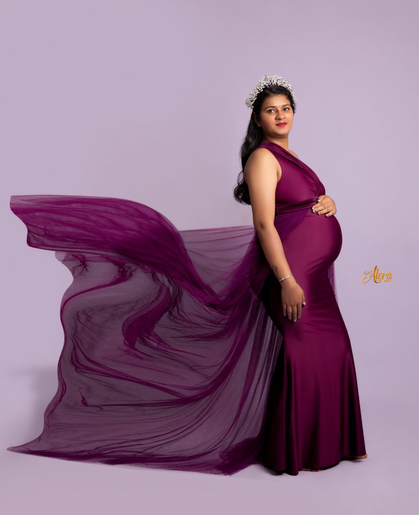 Pregnant woman wearing luxury maternity photography dress in Melbourne studio