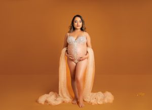 Pregnant mother posing during affordable maternity photography session in Melbourne studio