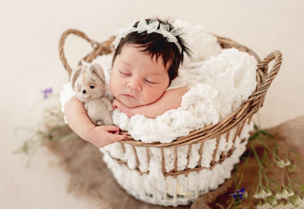 At home newborn photographer Melbourne photographing baby with family in natural setting