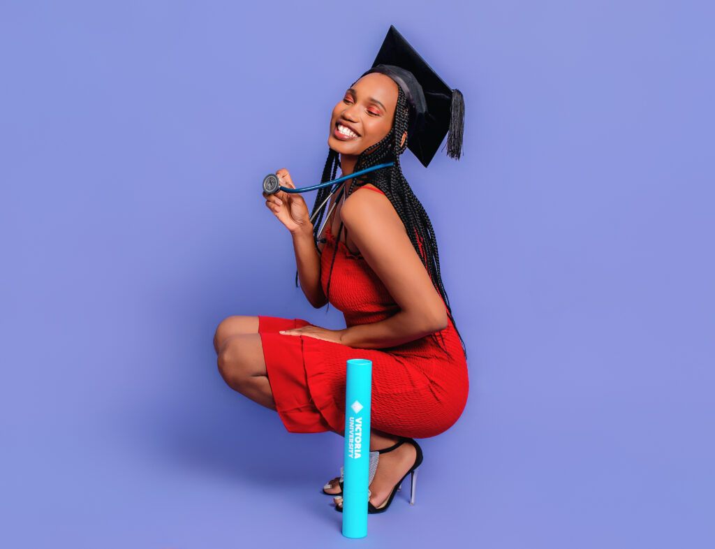 Fashion-inspired graduation portrait session with graduate wearing black gown and cap