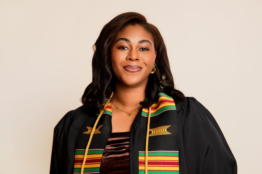 Graduate posing in cap and gown during a luxury graduation photography session in Melbourne studio