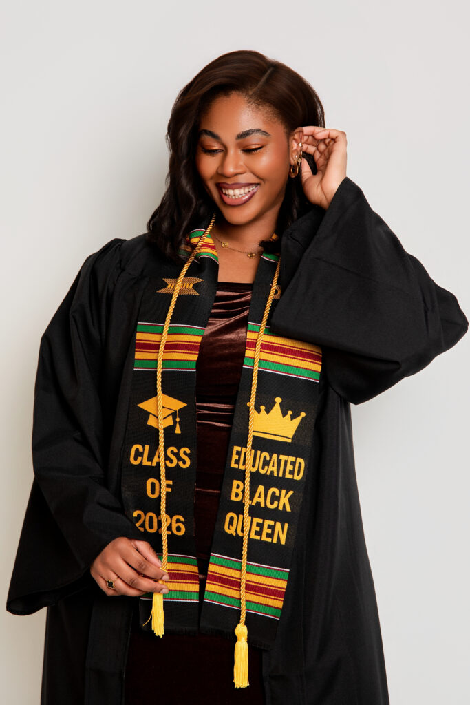 Graduate posing with cap and diploma in editorial-style graduation photography session