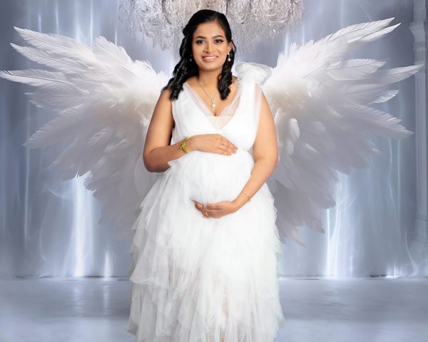 Pregnant mother wearing an elegant maternity gown during a luxury maternity photoshoot at Kat Alora Photography studio in Cranbourne North near Cranbourne East Melbourne.