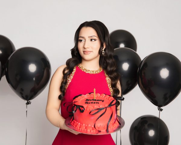 Elegant woman celebrating a milestone birthday during a luxury birthday photography session at Kat Alora Photography studio in Cranbourne North, Melbourne, featuring glamorous styling and professional studio lighting.