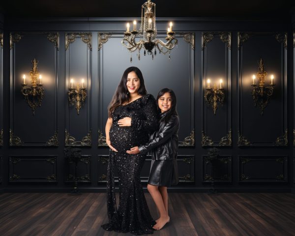 Woman in late pregnancy posing gracefully on studio set